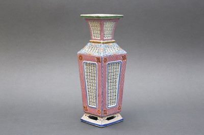 Lot 104 - A CHINESE FAMILLE-ROSE RETICULATED VASE