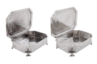 Lot 577 - A pair of Charles II sterling silver chinoiserie toilet caskets, London 1683 by Ralph Leake (free 1671)