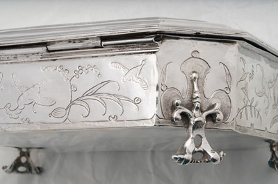 Lot 577 - A pair of Charles II sterling silver chinoiserie toilet caskets, London 1683 by Ralph Leake (free 1671)