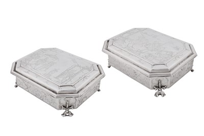 Lot 577 - A pair of Charles II sterling silver chinoiserie toilet caskets, London 1683 by Ralph Leake (free 1671)