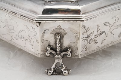 Lot 577 - A pair of Charles II sterling silver chinoiserie toilet caskets, London 1683 by Ralph Leake (free 1671)