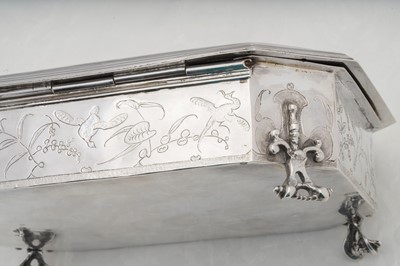 Lot 577 - A pair of Charles II sterling silver chinoiserie toilet caskets, London 1683 by Ralph Leake (free 1671)