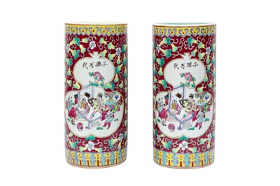 Lot 131 - A PAIR OF CHINESE FAMILLE-ROSE RUBY-GROUND HAT STANDS