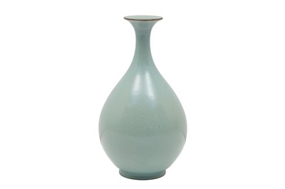 Lot 311 - A CHINESE PEAR-SHAPED CELADON-GLAZED VASE