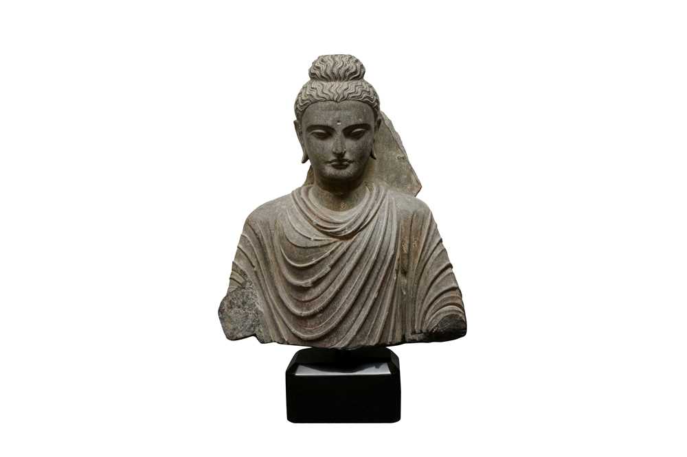 Lot 196 - A LARGE CARVED GANDHARA GREY SCHIST BUST OF THE HISTORICAL BUDDHA, SIDDHARTHA GAUTAMA SHAKYAMUNI