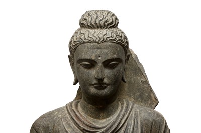 Lot 196 - A LARGE CARVED GANDHARA GREY SCHIST BUST OF THE HISTORICAL BUDDHA, SIDDHARTHA GAUTAMA SHAKYAMUNI