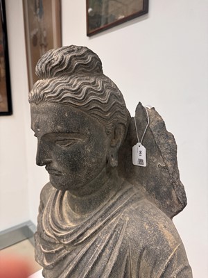 Lot 196 - A LARGE CARVED GANDHARA GREY SCHIST BUST OF THE HISTORICAL BUDDHA, SIDDHARTHA GAUTAMA SHAKYAMUNI