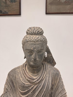 Lot 196 - A LARGE CARVED GANDHARA GREY SCHIST BUST OF THE HISTORICAL BUDDHA, SIDDHARTHA GAUTAMA SHAKYAMUNI