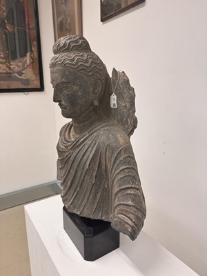 Lot 196 - A LARGE CARVED GANDHARA GREY SCHIST BUST OF THE HISTORICAL BUDDHA, SIDDHARTHA GAUTAMA SHAKYAMUNI