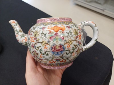 Lot 584 - A CHINESE FAMILLE-ROSE WHITE-GROUND TEAPOT AND COVER