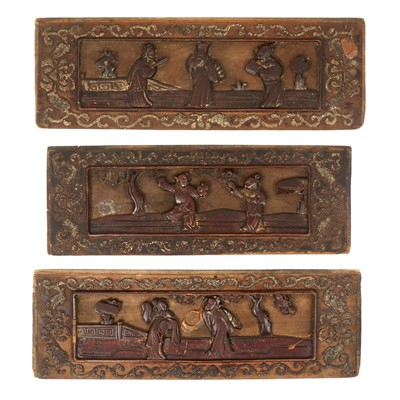 Lot 551 - A set of three Chinese carved wooden panels
