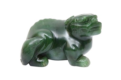 Lot 528 - A CHINESE GREEN JADE CARVING OF A MYTHICAL BEAST