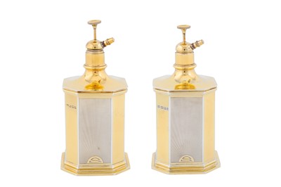 Lot 147 - A pair of George V parcel gilt sterling silver dressing table scent bottle atomisers, London 1935 by Mappin and Webb