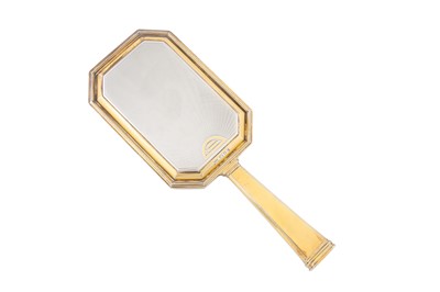 Lot 146 - A George V Art Deco parcel gilt sterling silver dressing table hand mirror, London 1935 by Mappin and Webb