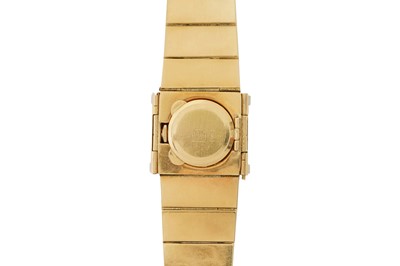 Lot 273 - A LADY'S GOLD AND DIAMOND-SET BRACELET WATCH