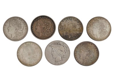 Lot 135 - A GROUP OF SEVEN SILVER DOLLARS (MORGAN & PEACE TYPES)