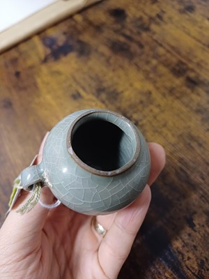 Lot 291 - A CHINESE LONGQUAN CELADON-GLAZED BIRD FEEDER