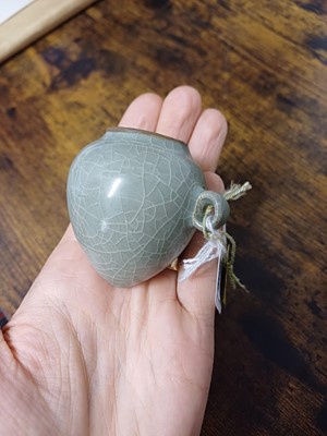 Lot 291 - A CHINESE LONGQUAN CELADON-GLAZED BIRD FEEDER