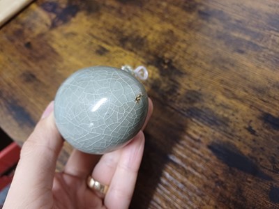 Lot 291 - A CHINESE LONGQUAN CELADON-GLAZED BIRD FEEDER