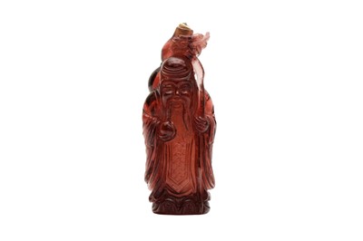 Lot 339 - λ A CHINESE AMBER COLOURED GLASS 'SHOU LAO' SNUFF BOTTLE