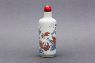 Lot 317 - λ A FINE CHINESE BLUE AND WHITE AND COPPER-RED 'LOTUS POND' SNUFF BOTTLE