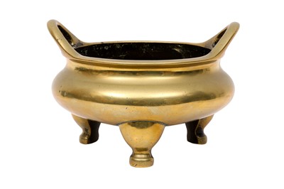 Lot 563 - A CHINESE POLISHED BRONZE TRIPOD CENSER