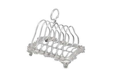 Lot 491 - A Victorian sterling silver “Teniers” seven bar toast rack, London 1860 by John Samuel Hunt