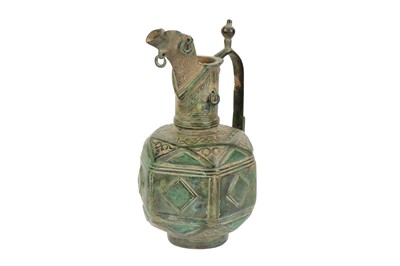 Lot 29 - A RARE AND UNUSUAL SELJUK BRONZE EWER