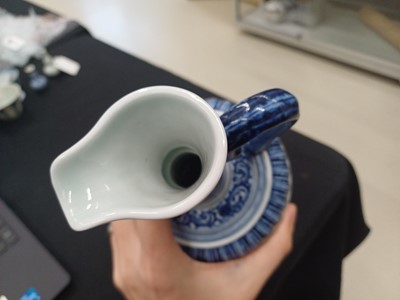 Lot 307 - A CHINESE BLUE AND WHITE 'LOTUS' EWER