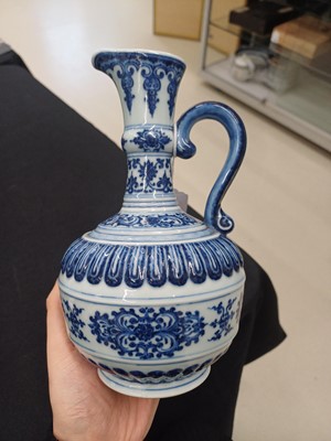 Lot 307 - A CHINESE BLUE AND WHITE 'LOTUS' EWER