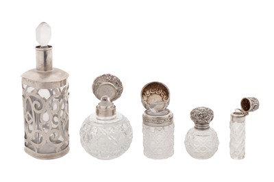 Lot 233 - A mixed group of silver mounted scent bottles