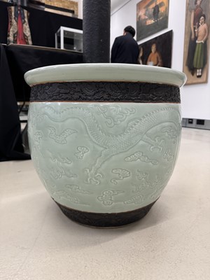 Lot 298 - A VERY LARGE CHINESE CELADON-GLAZED 'DRAGON' FISH BOWL