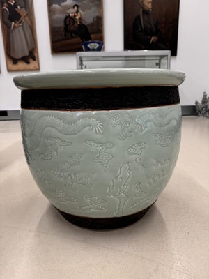 Lot 298 - A VERY LARGE CHINESE CELADON-GLAZED 'DRAGON' FISH BOWL