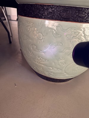 Lot 298 - A VERY LARGE CHINESE CELADON-GLAZED 'DRAGON' FISH BOWL