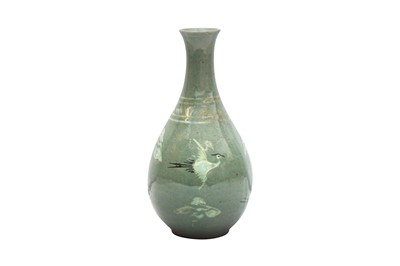 Lot 391 - A KOREAN INLAID SLIP-DECORATED CELADON 'CRANE' BOTTLE VASE