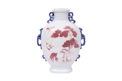 Lot 632 - A CHINESE COPPER-RED AND WHITE 'DEER AND CRANE' VASE