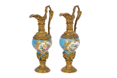 Lot 235 - A PAIR OF SEVRES STYLE PORCELAIN GARNITURE EWERS