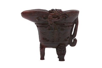 Lot 175 - λ A CHINESE CARVED YAK HORN LIBATION CUP