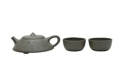 Lot 740 - A CHINESE SET OF YIXING GREEN 'LANDSCAPE' TEA POT AND CUPS