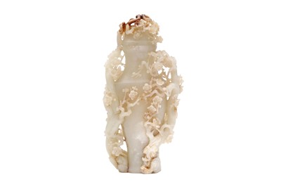 Lot 550 - A CHINESE JADE ‘PRUNUS’ VASE AND COVER