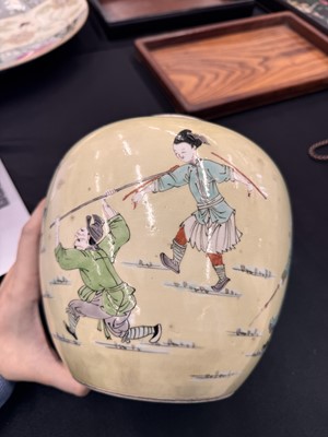 Lot 142 - A CHINESE FAMILLE-VERTE YELLOW-GROUND 'WARRIORS' JAR