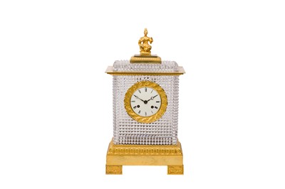 Lot 411 - MANNER OF BACCARAT; A FRENCH CRYSTAL AND ORMOLU MANTEL CLOCK