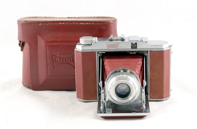 Lot 213 - A Rare Red Covered Fotizik "Reporter" Folding 120 Camera.