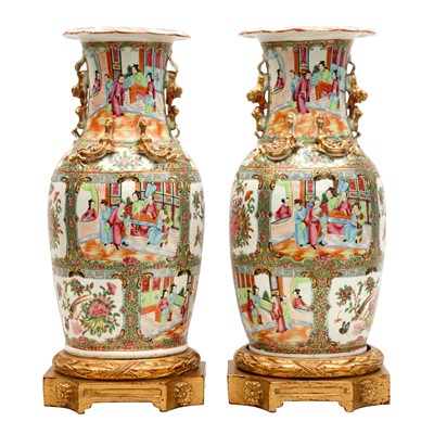 Lot 492 - A pair of Chinese Canton export famille-rose vases, Qing dynasty, 19th century