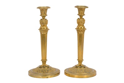 Lot 432 - A PAIR OF FRENCH EMPIRE STYLE GILT CANDLESTICKS