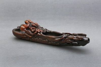 Lot 173 - A RARE CHINESE RHINOCEROS HORN 'ZHANG QIAN IN A RAFT' POURING VESSEL