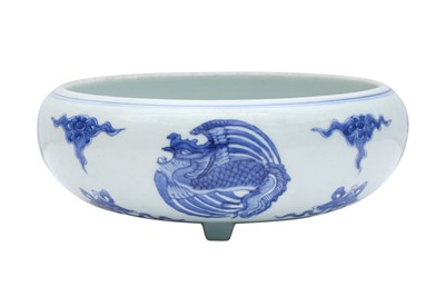 Lot 438 - A CHINESE BLUE AND WHITE 'PHOENIX' TRIPOD CENSER