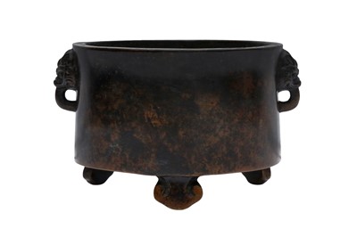 Lot 202 - A CHINESE BRONZE TRIPOD CENSER WITH LION-MASK HANDLES