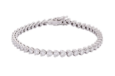 Lot 113 - A DIAMOND LINE BRACELET