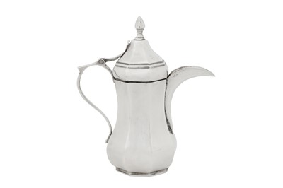 Lot 245 - A rare early 20th century Iraqi silver dallah coffee pot, Baghdad circa 1930 by Shuwa’ Jangana and Bros